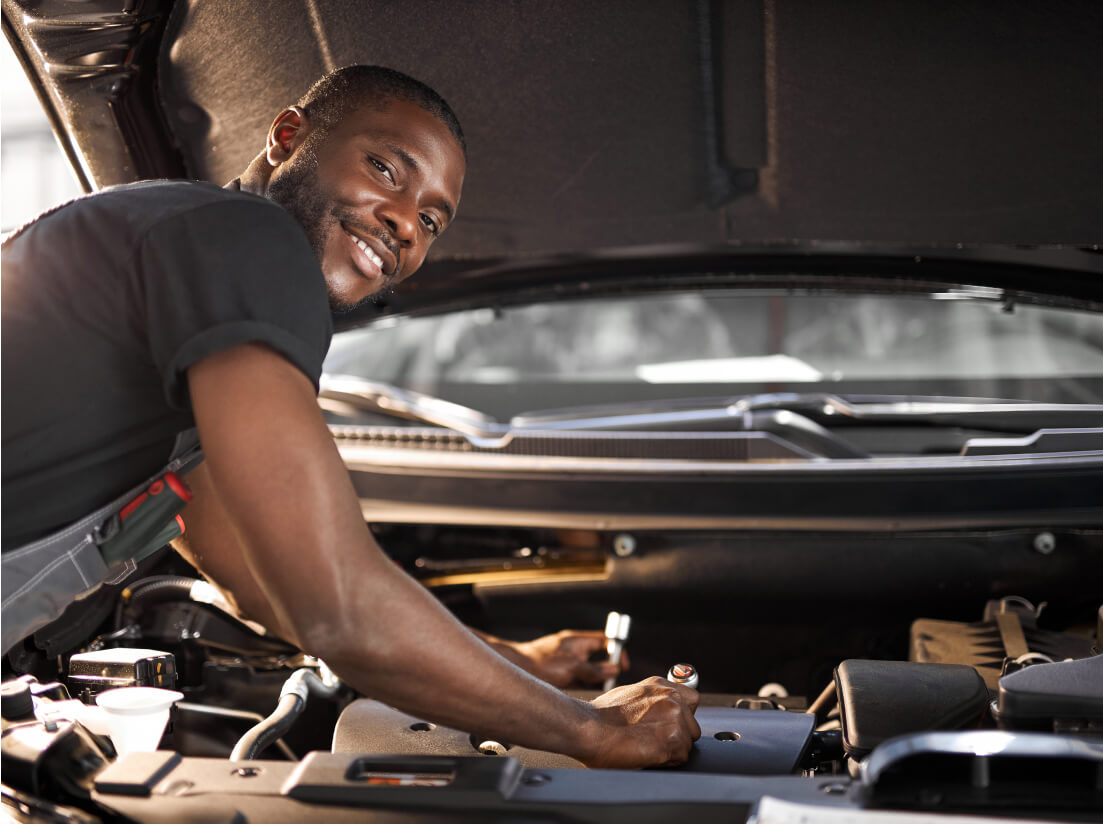 Man Repairing Vehicle